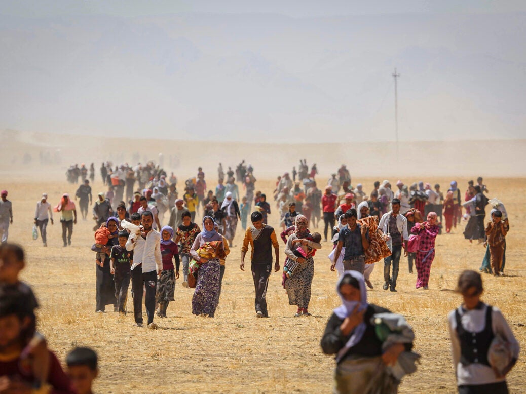Тысячи езидов были спасены курдскими силами, когда они пытались бежать от Исламского государства в 2014 году. (Фото Emrah Yorulmaz/Anadolu Agency/Getty Images)
